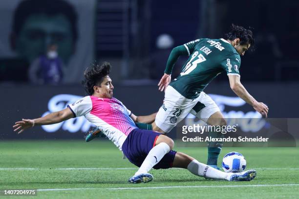 Marcelo Moreno of Cerro Porteño fights for the ball with Raphael Veiga of Palmeiras during a Copa Libertadores round of sixteen second leg match...