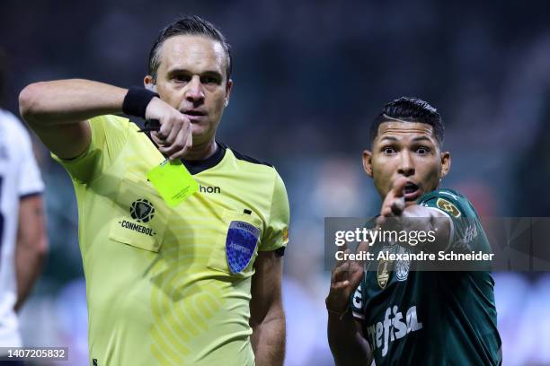 Rony of Palmeiras receives a yellow card during a Copa Libertadores round of sixteen second leg match between Palmeiras and Cerro Porteño at Allianz...