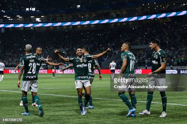 Breno Lopes of Palmeiras celebrates with teammates after scoring his team's third goal during a Copa Libertadores round of sixteen second leg match...