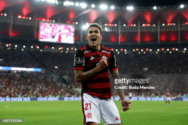 Pedro of Flamengo celebrates with teammate after scoring the fifth goal of his team during a Copa Libertadores round of sixteen second leg match...
