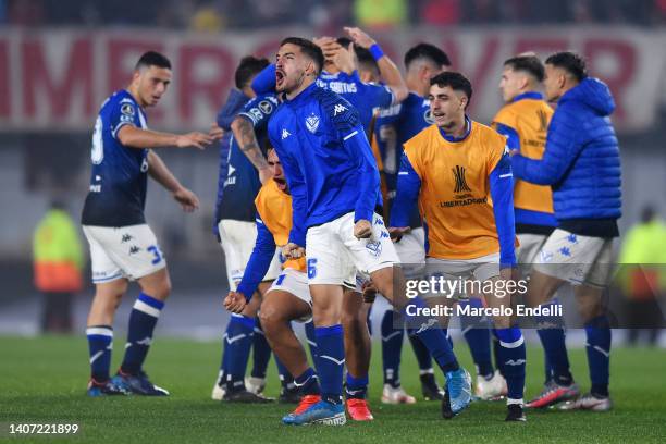 Players of Velez celebrate qualifying to the next round after a Copa Libertadores round of sixteen second leg match between Velez and River Plate at...