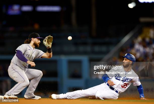 Cody Bellinger of the Los Angeles Dodgers steals second base against Brendan Rodgers of the Colorado Rockies in the fifth inning at Dodger Stadium on...