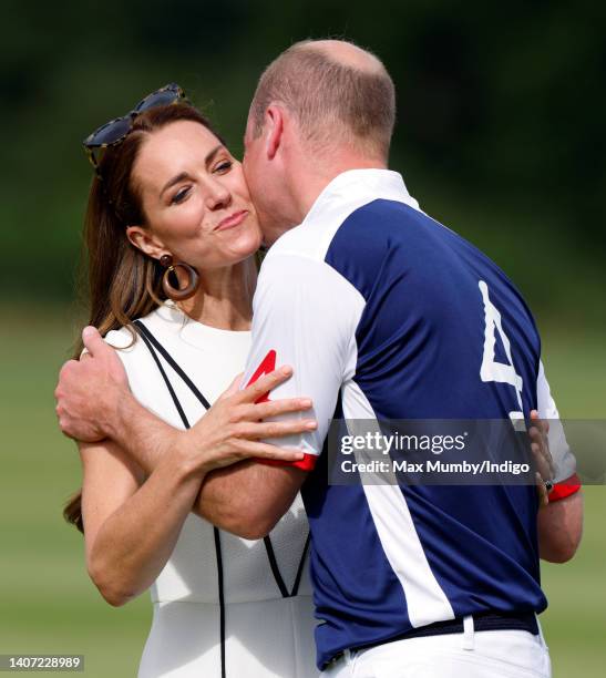 Catherine, Duchess of Cambridge kisses Prince William, Duke of Cambridge during the prize-giving of the Out-Sourcing Inc. Royal Charity Polo Cup at...