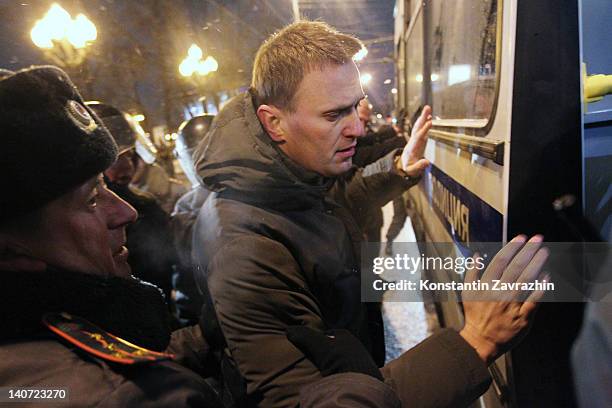 Moscow riot police detain an opposition leader Alexei Navalny an unsacnctioned anti-Putin opposition rally at the Pushkin Square March 5, 2012 in...