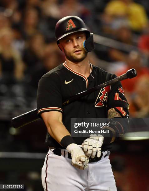 Christian Walker of the Arizona Diamondbacks reacts after a strike call during the ninth inning against the San Francisco Giants at Chase Field on...