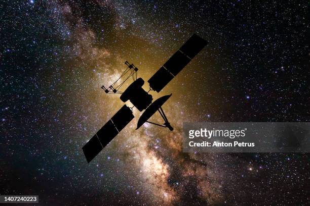 communications satellite on the background of the starry sky. satellite connection - satellite dish fotografías e imágenes de stock