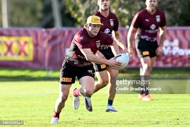Harry Grant runs with the ball during a Queensland Maroons State of Origin training session at Sanctuary Cove on July 07, 2022 in Gold Coast,...