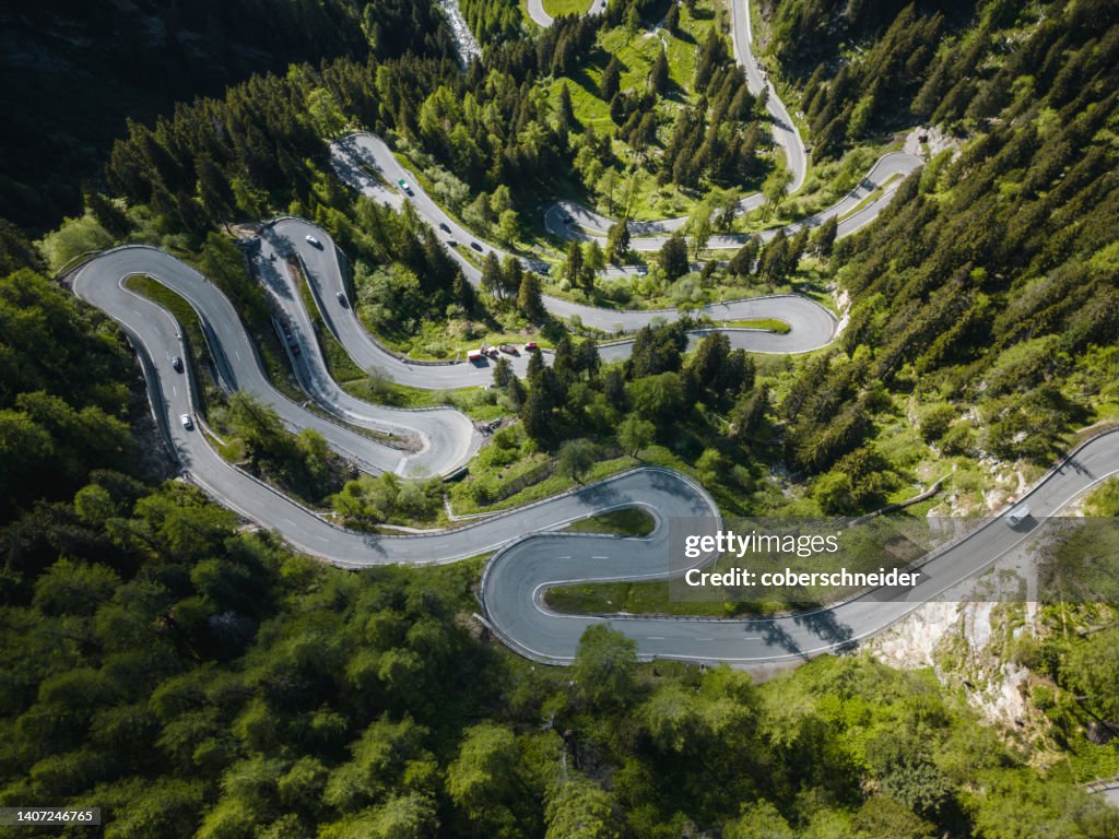 Aerial view of cars driving along Maloja mountain pass road, Engadin, Graubunden, Switzerland