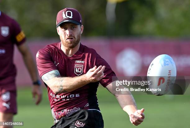 Cameron Munster passes the ball during a Queensland Maroons State of Origin training session at Sanctuary Cove on July 07, 2022 in Gold Coast,...