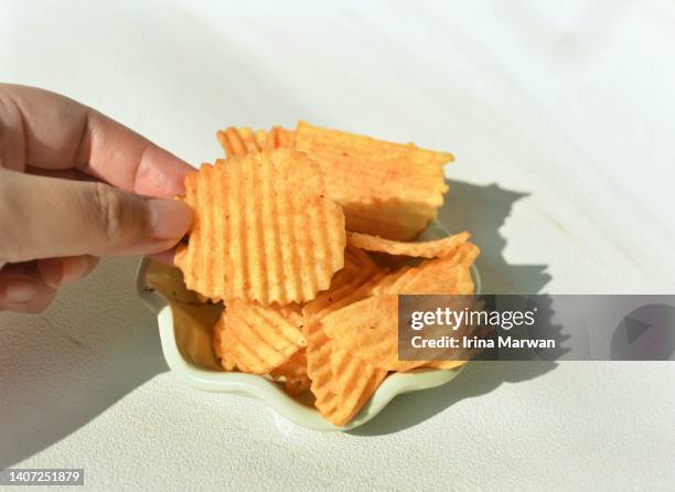 eating potato chips - sodium stock pictures, royalty-free photos & images