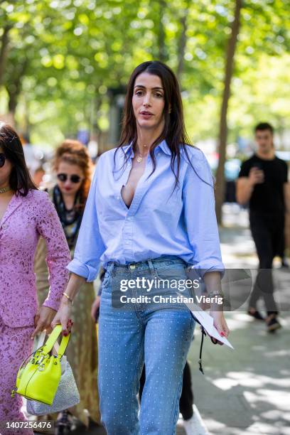 Guest is seen wearing denim jeans, blue button shirt, yellow Fendi bucket bag outside Zuhair Murad during Paris Fashion Week - Haute Couture Fall...