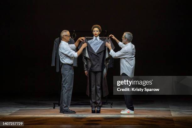 Designers Viktor Horsting and Rolf Snoeren dress a model during the Viktor & Rolf Haute Couture Fall Winter 2022 2023 show as part of Paris Fashion...