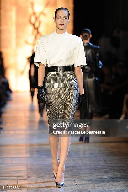 Model walks the runway during the Yves Saint-Laurent Ready-To-Wear Fall/Winter 2012 show as part of Paris Fashion Week on March 5, 2012 in Paris,...