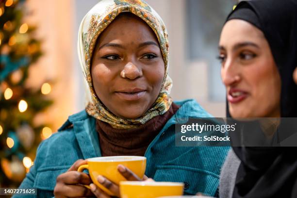 hot coffee and a chat on a winters day - islam ornament stock pictures, royalty-free photos & images