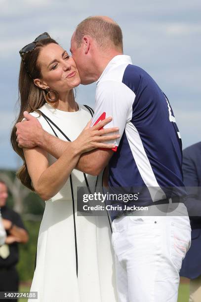 Prince William, Duke of Cambridge and Catherine, Duchess of Cambridge embrace after the Royal Charity Polo Cup 2022 at Guards Polo Club during the...