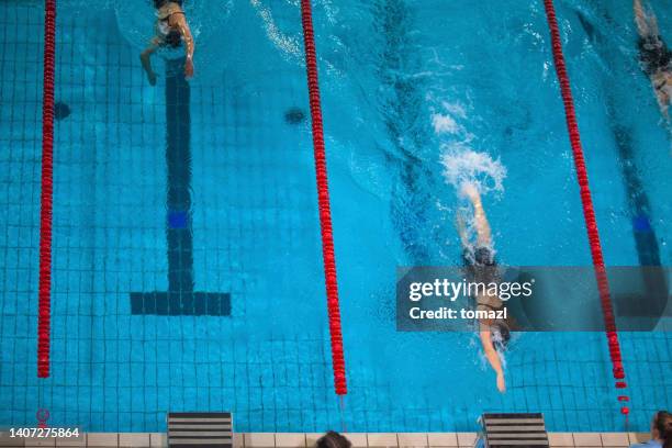 swimming competition freestyle - swim meet stock pictures, royalty-free photos & images