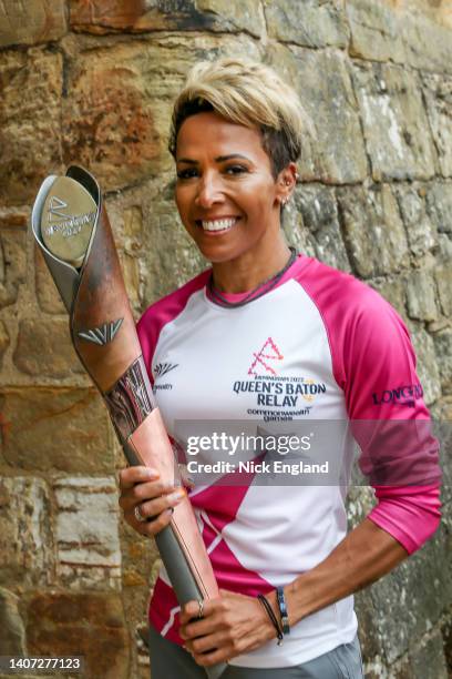 Dame Kelly Holmes holds the Queen's Baton during the Birmingham 2022 Queen's Baton Relay at a visit to Tonbridge Castle, on July 7, 2022 in...