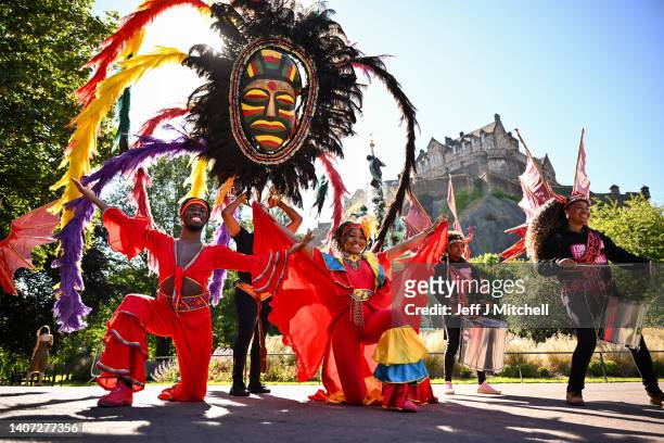 Methetheli from Capetown poses with dancers Marquise and Okia from Port Spain Trinidad pose during a photo call at Ross Fountain, Princes Street...