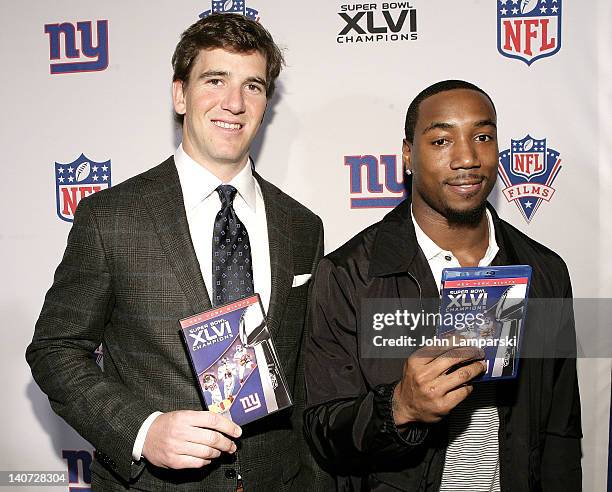 Giants Eli Manning and Mario Manningham attend the Super Bowl XLVI Champions: New York Giants "Blue Carpet" VIP premiere at the Regal E-Walk Stadium...