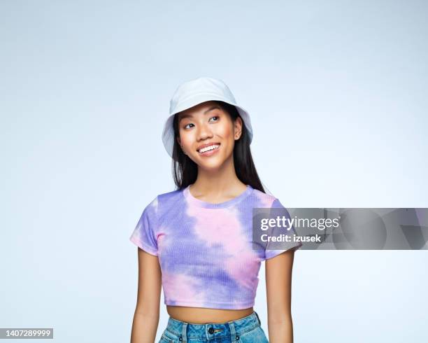 young woman in lilac tie dye top - bucket hat stock pictures, royalty-free photos & images