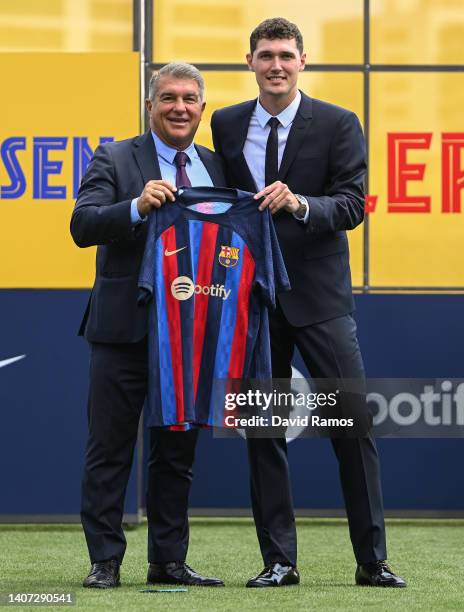 Barcelona president Joan Laporta and Andreas Christensen pose for the media as he is presented as a FC Barcelona player at Ciutat Esportiva Joan...
