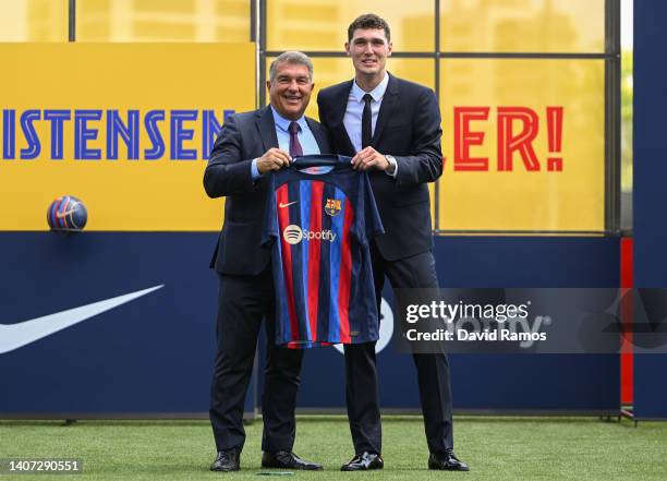Barcelona president Joan Laporta and Andreas Christensen pose for the media as he is presented as a FC Barcelona player at Ciutat Esportiva Joan...