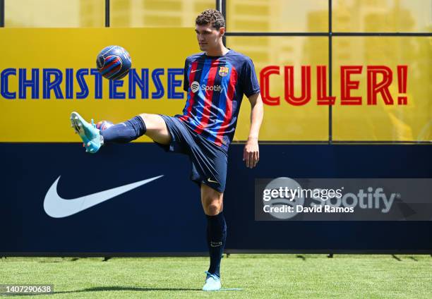 Andreas Christensen juggles the ball as poses for the media during the presentation as a FC Barcelona player at Ciutat Esportiva Joan Gamper on July...