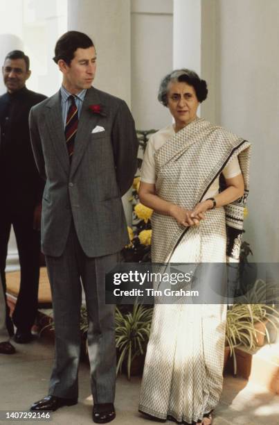 Prince Charles stands beside Prime Minister of India Indira Gandhi at her home in Delhi, India, November 1980.