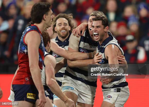 Tom Hawkins of the Cats celebrates after scoring a goal during the round 17 AFL match between the Geelong Cats and the Melbourne Demons at GMHBA...