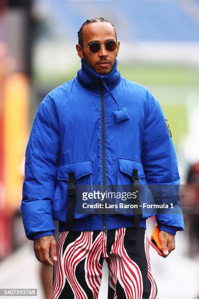 Lewis Hamilton of Great Britain and Mercedes walks in the Paddock during previews ahead of the F1 Grand Prix of Austria at Red Bull Ring on July 07,...