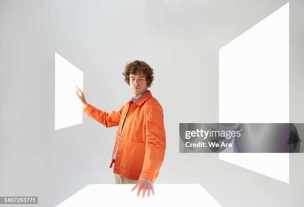 person interacting with multiple touch screens - interactivity stock pictures, royalty-free photos & images