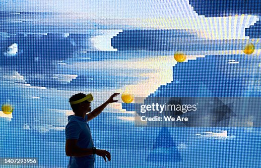 Silhouette of a man interacting with virtual computer graphics Silhouette of a man interacting with virtual computer graphics