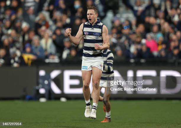 Mitch Duncan of the Cats celebrates after scoring a goal during the round 17 AFL match between the Geelong Cats and the Melbourne Demons at GMHBA...