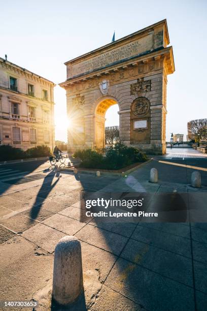 arc de triomphe at sunset, montpellier, occitanie, france - montpellier stockfoto's en -beelden