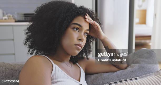 woman looking stressed. female suffering from depression. lady dealing with a breakup and heartbreak. girl feeling depressed and unhappy. black woman coping with anxiety. black woman looking sad - bird cry stock pictures, royalty-free photos & images