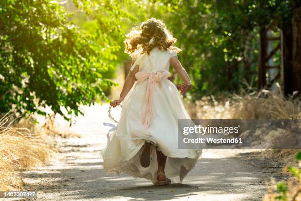 girl running on footpath in forest - comunhão imagens e fotografias de stock