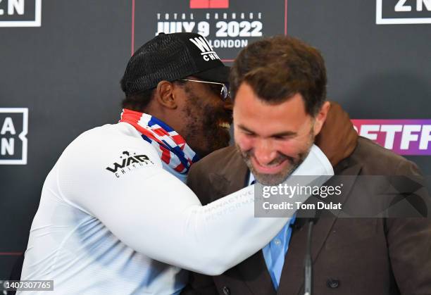 Dereck Chisora embraces Eddie Hearn, Boxing promoter for Matchroom Boxing during the Chisora v Pulev 2 Press Conference at Canary Riverside Plaza...