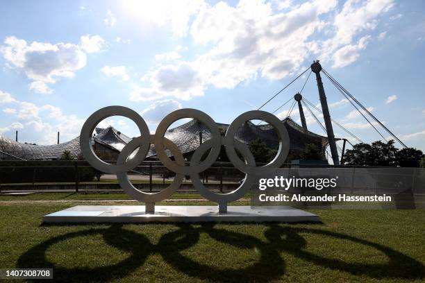 General view of the Olympic Rings in front of the Olympic Stadium at the Olympiapark on July 06, 2022 in Munich, Germany. The Olympiapark will host...