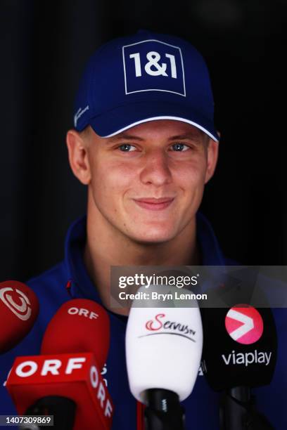 Mick Schumacher of Germany and Haas F1 talks to the media in the Paddock during previews ahead of the F1 Grand Prix of Austria at Red Bull Ring on...