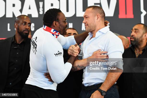 Dereck Chisora and Kubrat Pulev clash during the Chisora v Pulev 2 Press Conference at Canary Riverside Plaza Hotel on July 07, 2022 in London,...