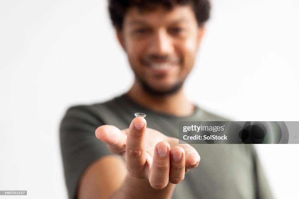 Holding Out Contact Lens