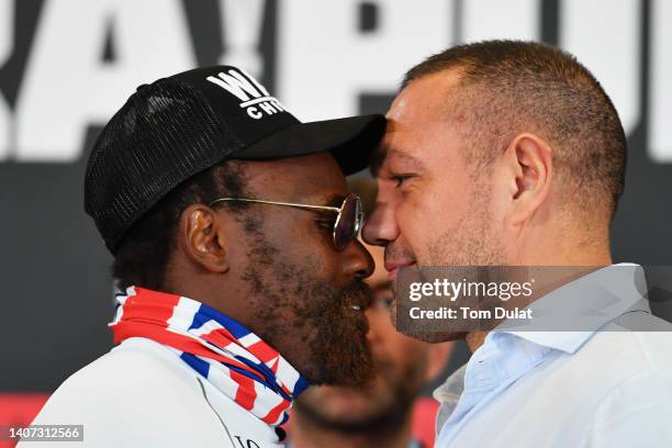 Dereck Chisora and Kubrat Pulev clash during the Chisora v Pulev 2 Press Conference at Canary Riverside Plaza Hotel on July 07, 2022 in London,...