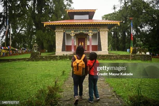 mother and daughter buddhist monastery - monastery stock pictures, royalty-free photos & images