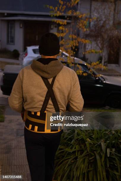 house moving process. owner and moving staff packing, protecting and transporting furniture and movables to moving truck - hombres maduros stock pictures, royalty-free photos & images