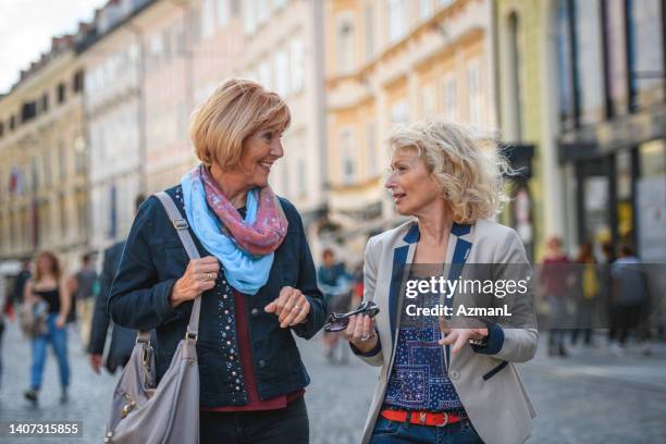 senior caucasian female best friends traveling together - fashionable grandma stock pictures, royalty-free photos & images