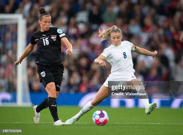 Leah Williamson of England and Jasmin Eder of Austria in action during the UEFA Women's Euro England 2022 group A match between England and Austria...