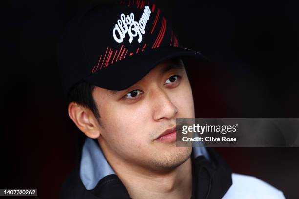 Zhou Guanyu of China and Alfa Romeo F1 talks to the media in the Paddock during previews ahead of the F1 Grand Prix of Austria at Red Bull Ring on...