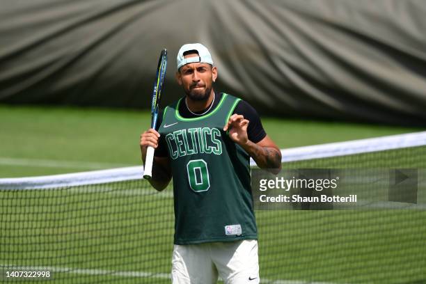 Nick Kyrgios of Australia is seen practising in a Boston Celtics Basketball Jersey on day eleven of The Championships Wimbledon 2022 at All England...