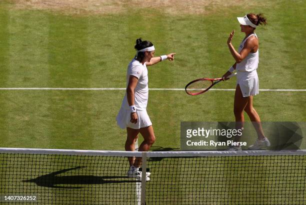 Match winner Ons Jabeur of Tunisia interacts with Tatjana Maria of Germany following their Women's Singles Semi-Final match on day eleven of The...