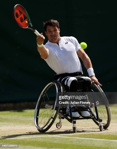 Gustavo Fernandez of Argentina plays a forehand against Nicolas Peifer of France during their Men's Wheelchair singles Quarter-Final on day eleven of...